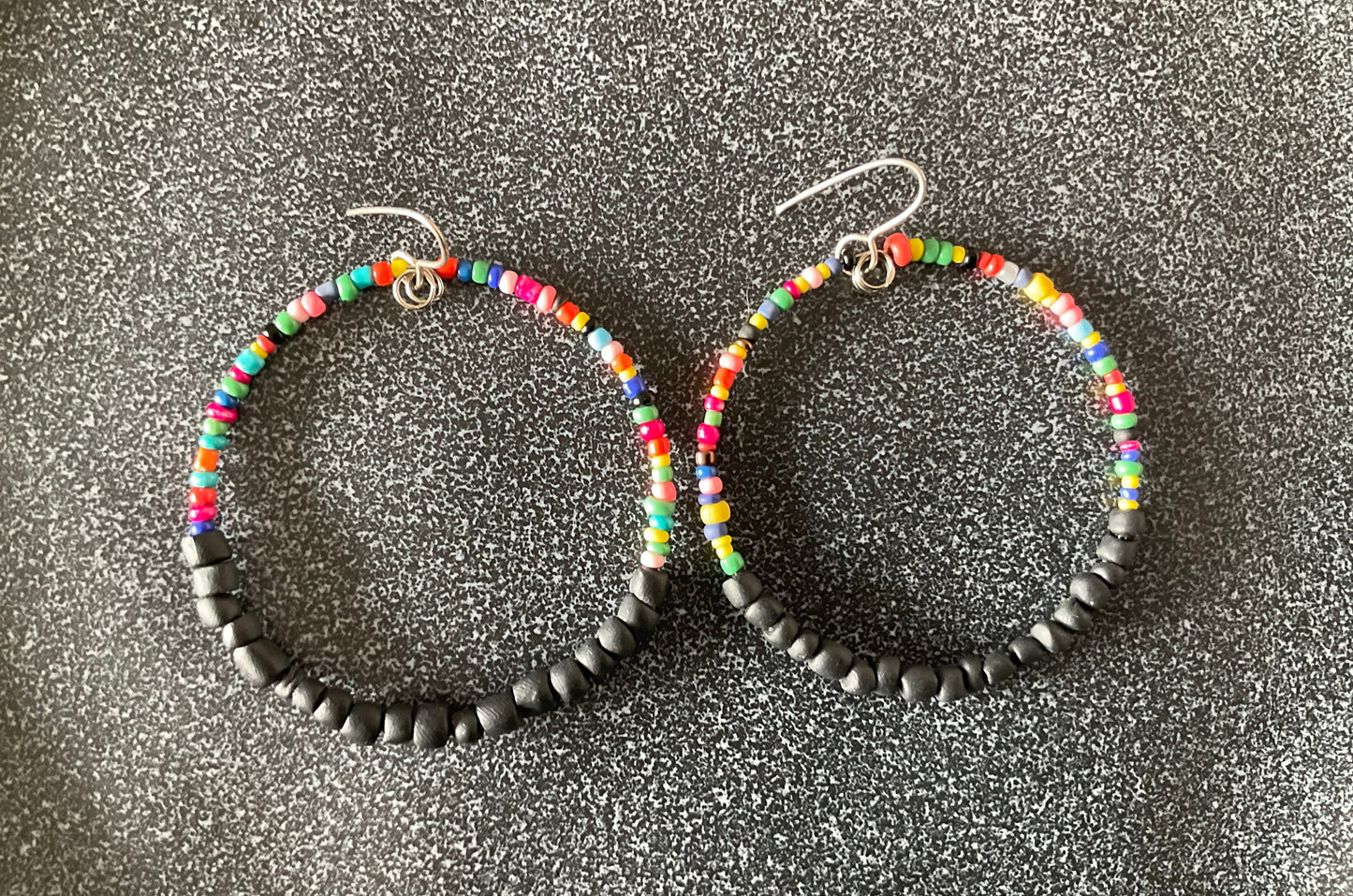 Hand rolled clay earrings - Rainbow + seed black
