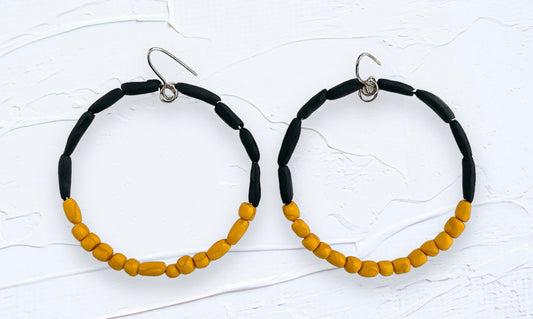 Hand rolled clay earrings - black + gold